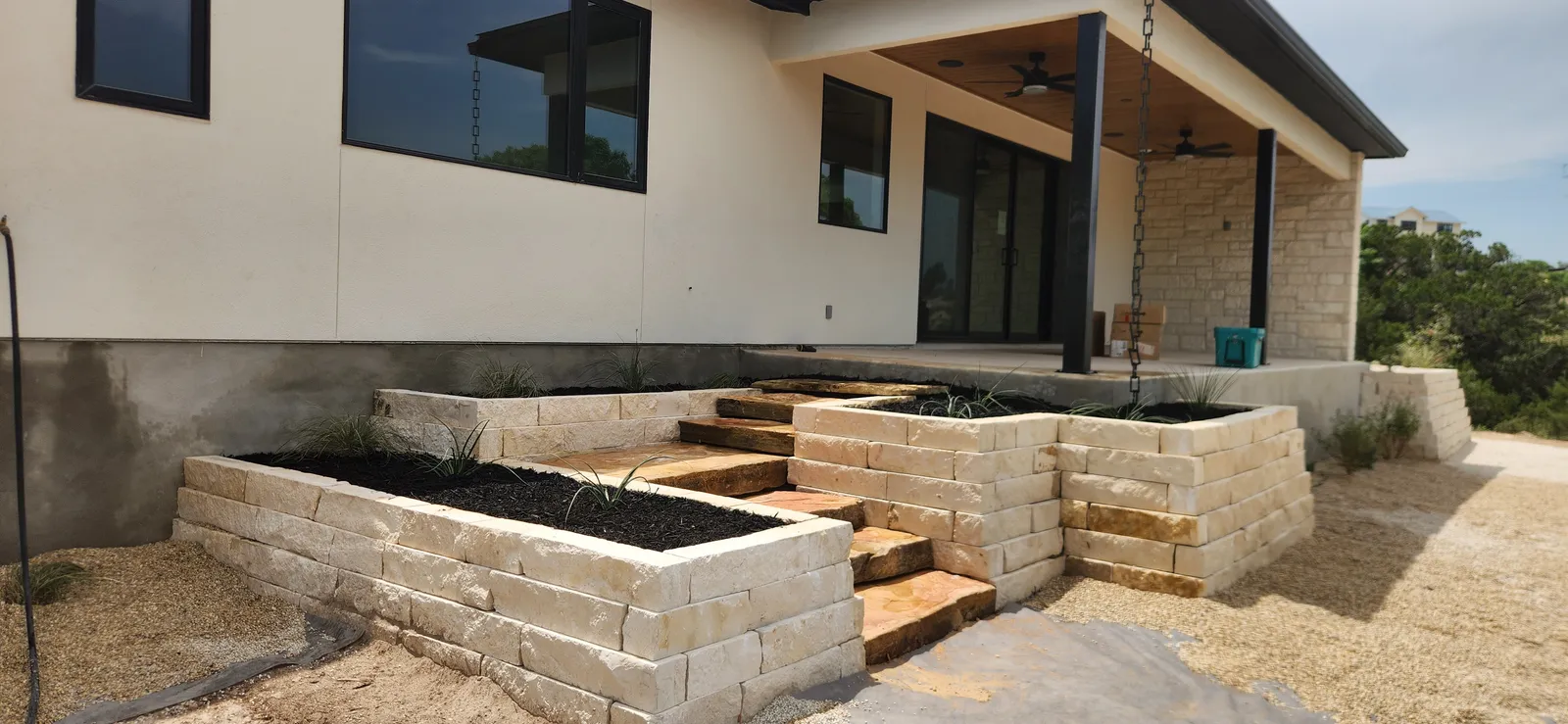 Raised stone planters under construction