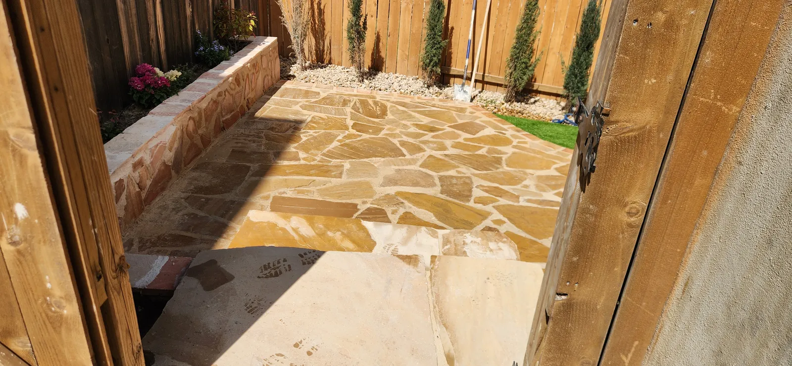 Natural flagstone patio installation