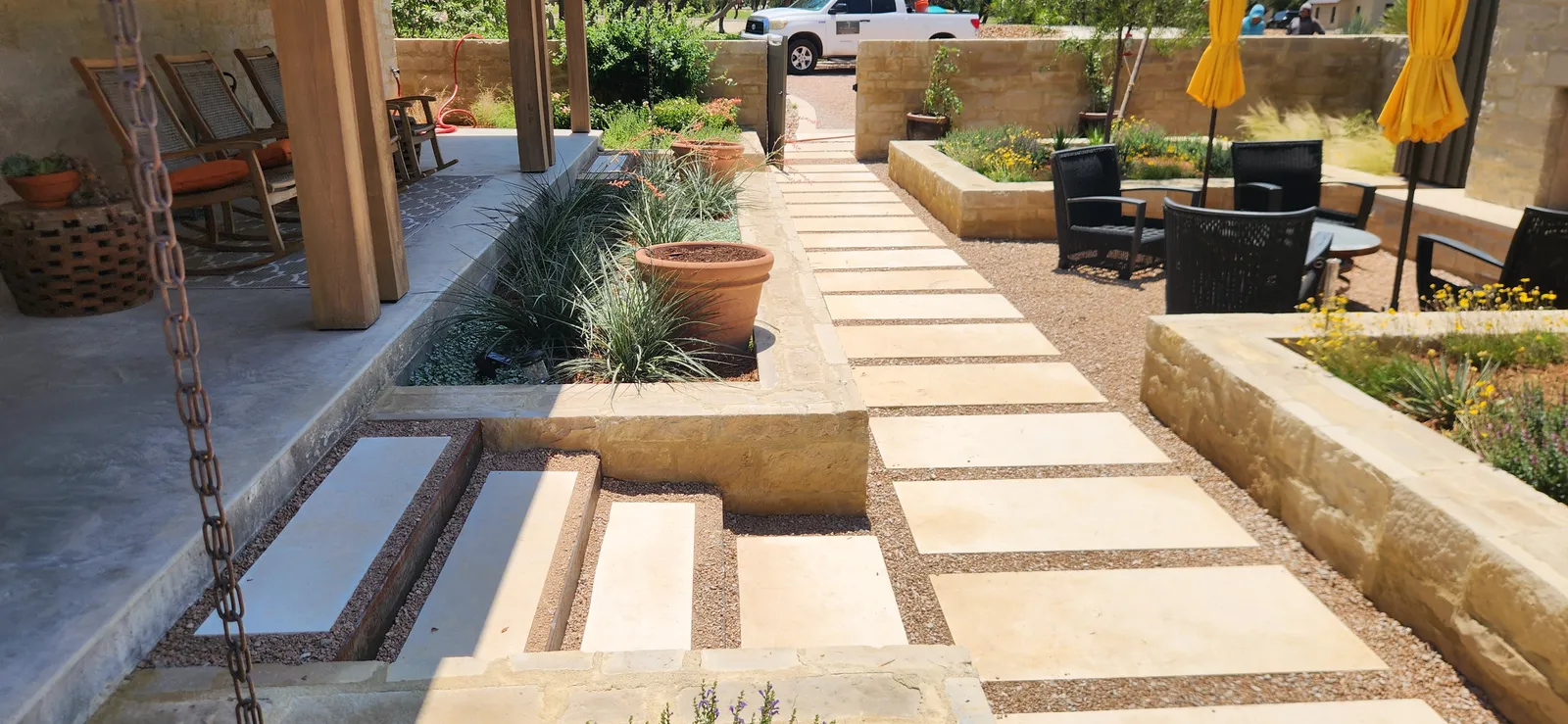 Bright garden walkway with raised planters