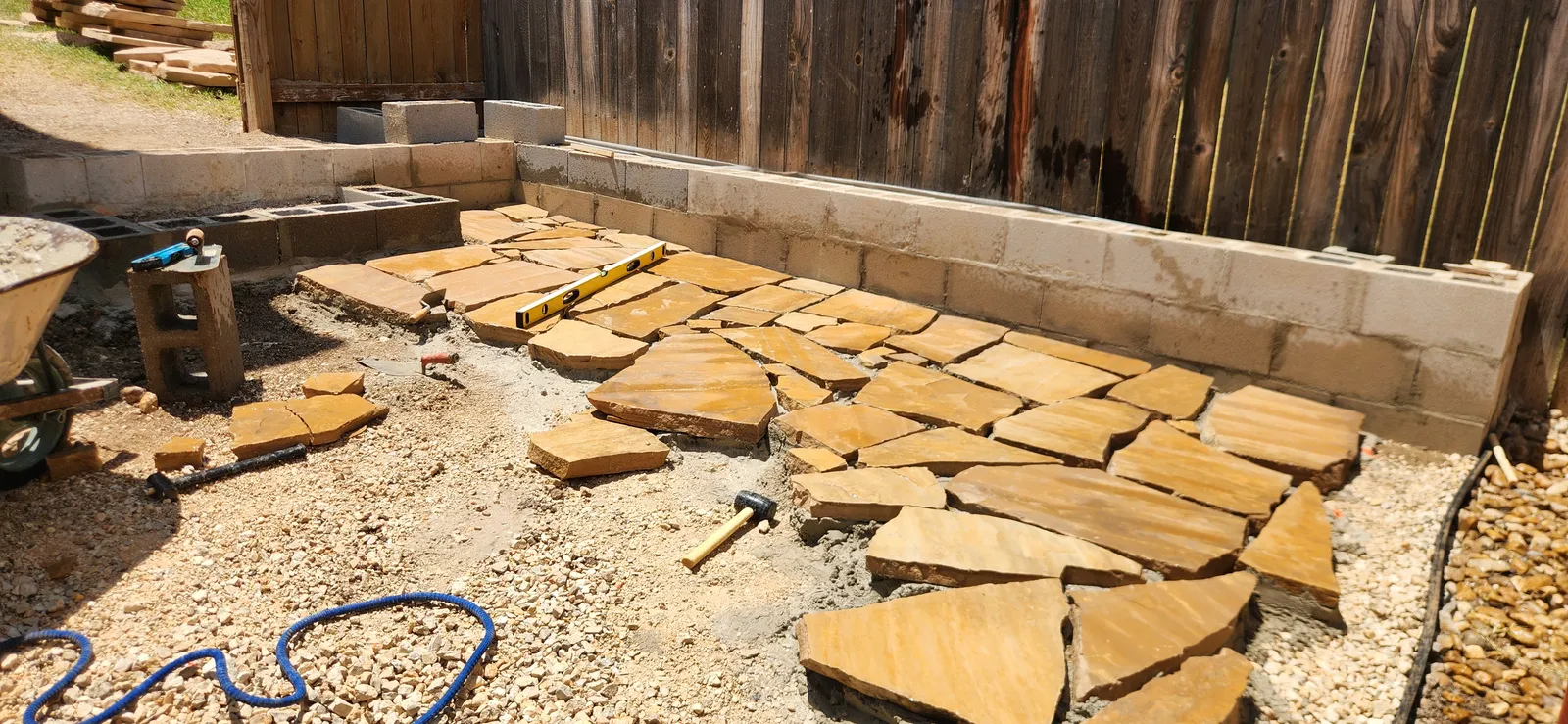 Natural flagstone being laid for a patio