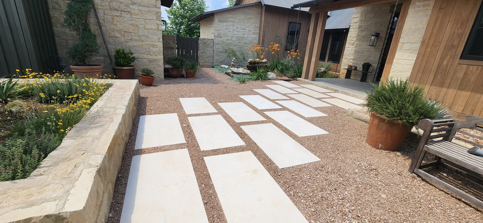 Finished geometric paver walkway with gravel detailing