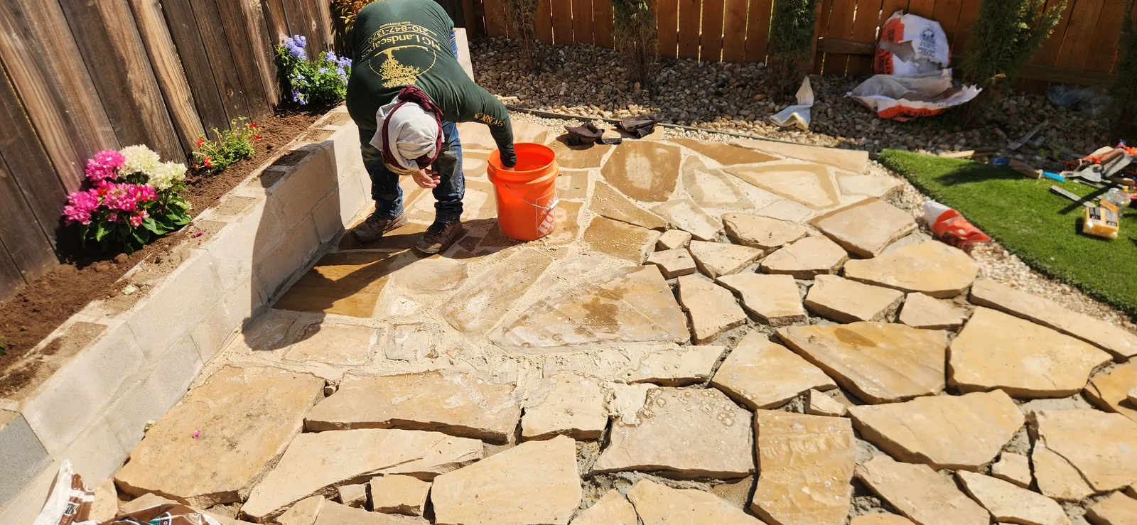 Craftsperson setting natural stone by hand